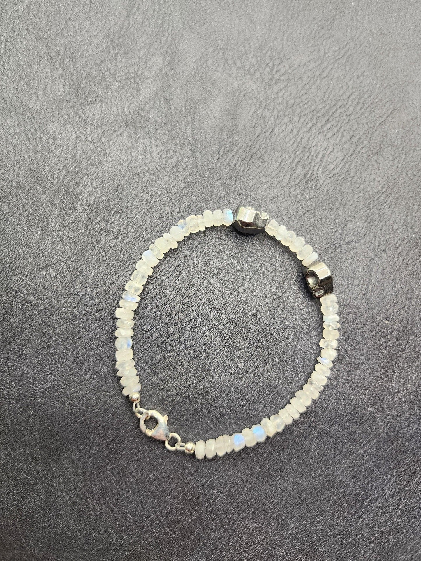Moonstone bracelet with hematite skulls. Sterling silver clasp and accessories. - Beaunique Boutique